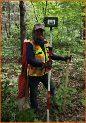 Surveyor with tools in the forest - Negaunee Ishpeming Iron Mountain Kingsford Norway Spread Eagle Auora